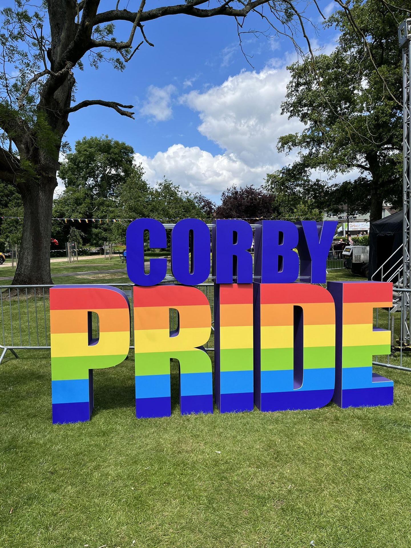 Corby Pride sign next to the main stage